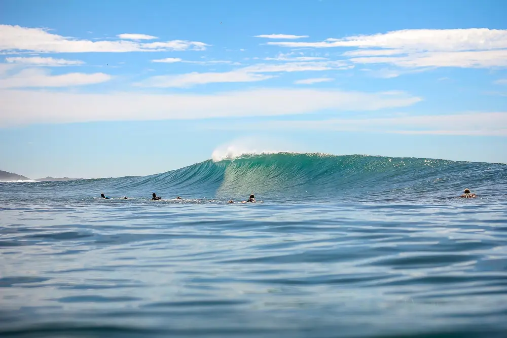 Surfers in the water at Playa Guiones
